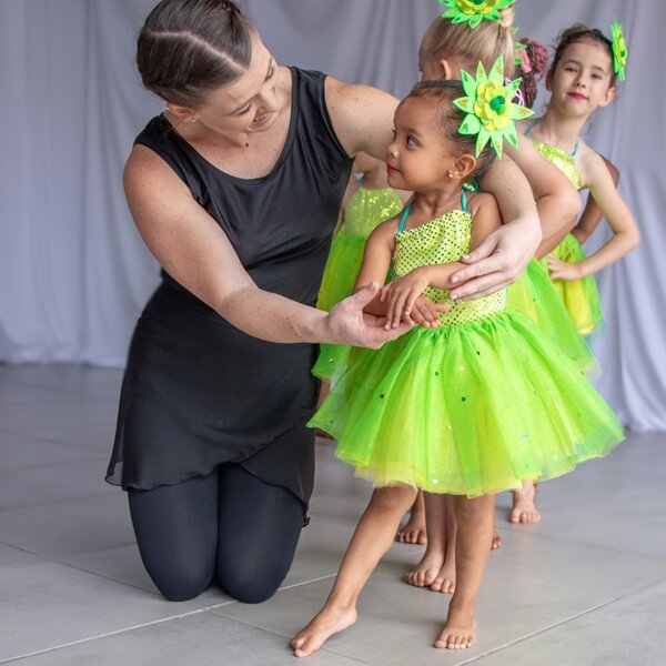 Young ballet dancers with teacher