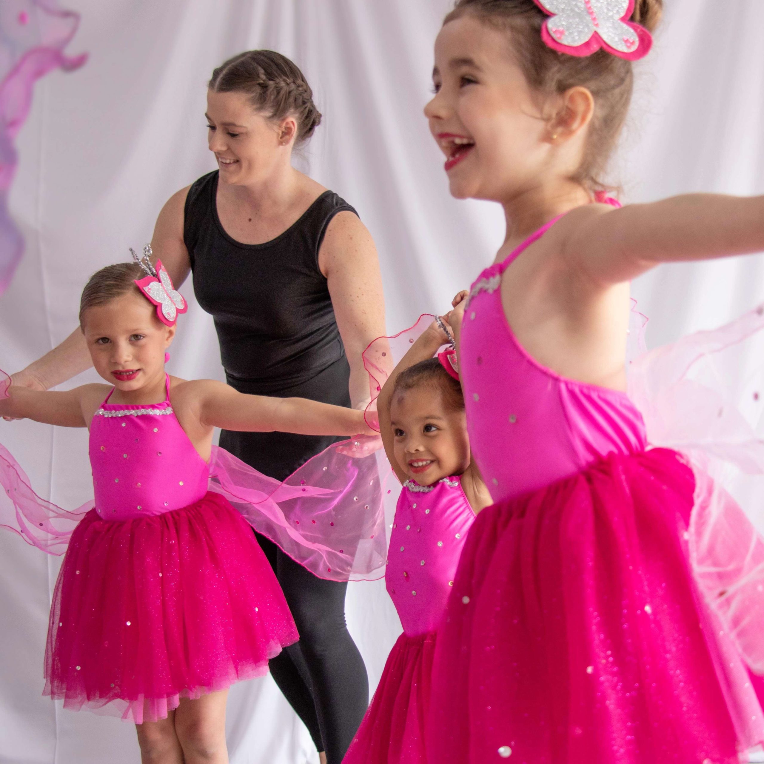 little girls dressed as butterflies during a modern dance lesson